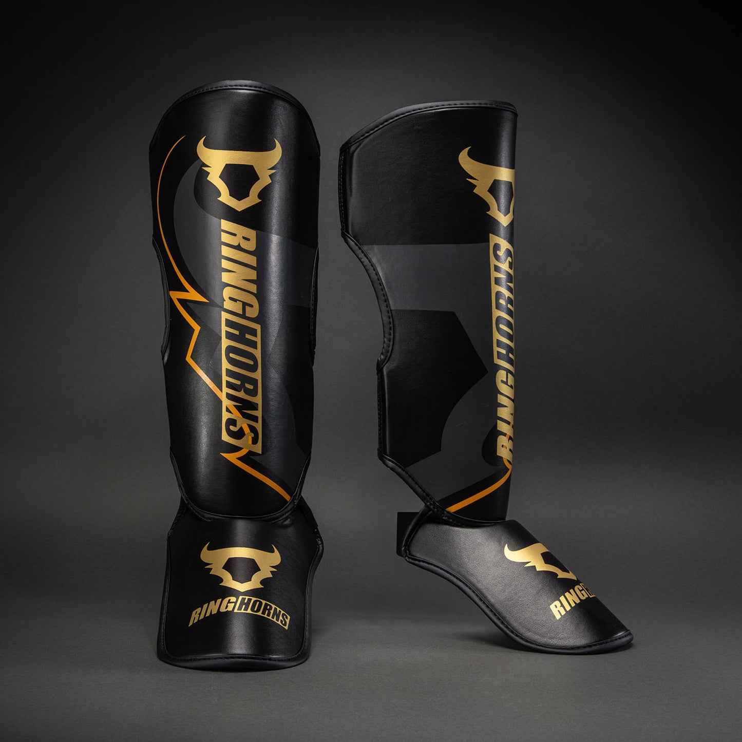 Ringhorns Charger by Venum Shin Guards - Black/Gold